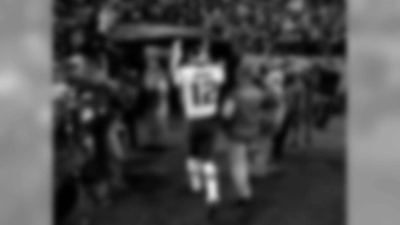 New England Patriots quarterback Tom Brady (12) cheers Patriots fans as he leaves the field after an NFL football game against the Denver Broncos, Sunday, Nov. 12, 2017, in Denver. The Patriots won 41-16. (AP Photo/Jack Dempsey)
