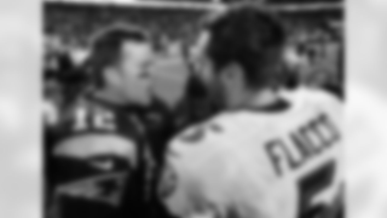 New England Patriots quarterback Tom Brady (12) and Baltimore Ravens quarterback Joe Flacco (5) speak at midfield after an NFL football game, Monday, Dec. 12, 2016, in Foxborough, Mass. (AP Photo/Steven Senne)