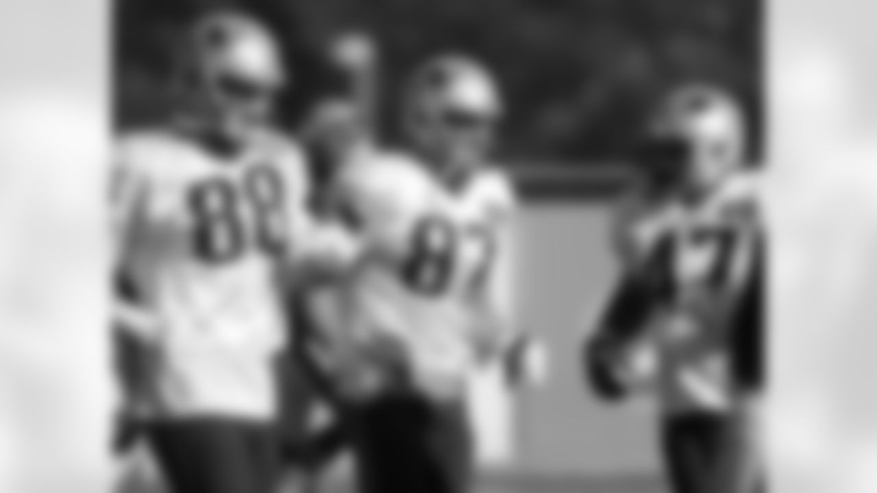 New England Patriots, from the left, tight end Scott Chandler, tight end Rob Gronkowski, and running back Joey Iosefa warm up on the field during an NFL football practice, Wednesday, Nov. 4, 2015, in Foxborough, Mass. The Washington Redskins are to play the Patriots Sunday, Nov. 8, 2015, in Foxborough. (AP Photo/Steven Senne)