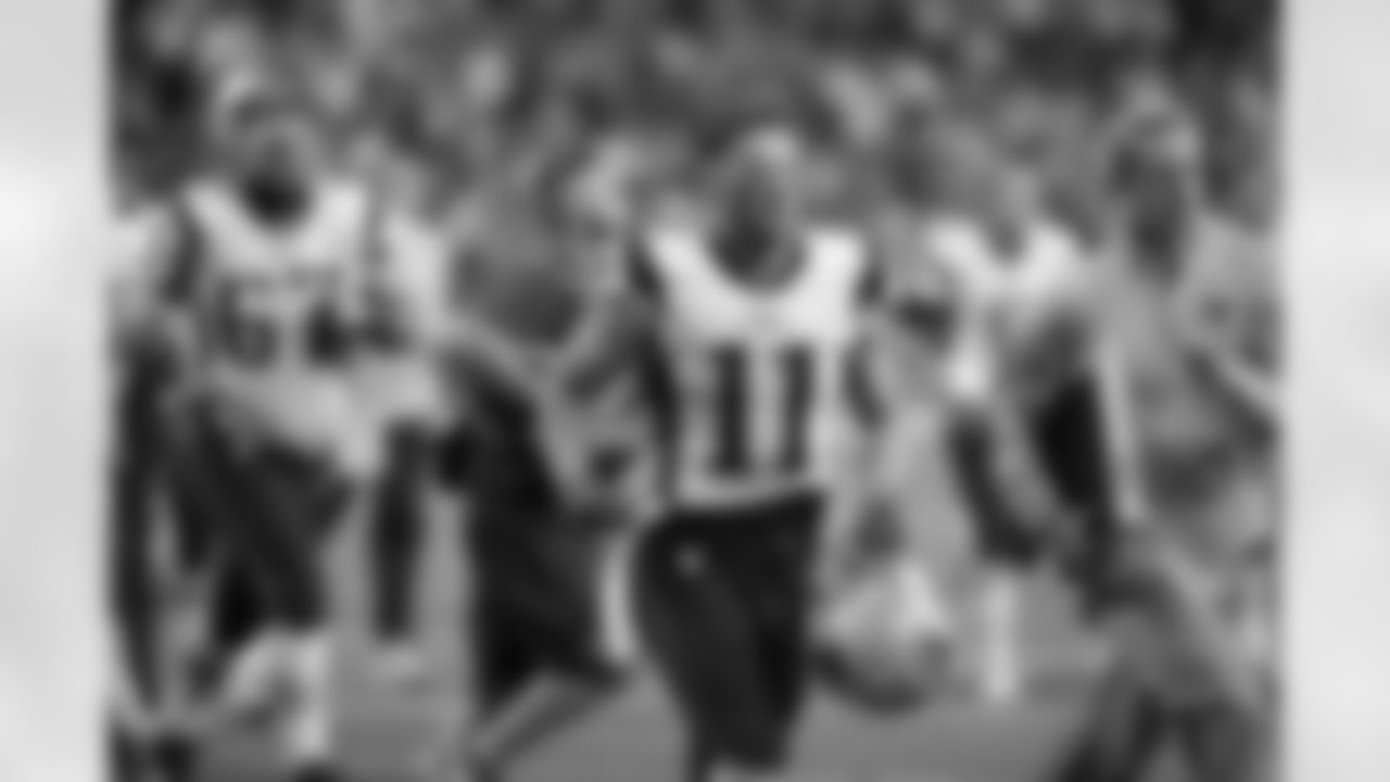 New England Patriots wide receiver Julian Edelman jogs off the field at the end of the first half of an NFL football game against the Indianapolis Colts in Indianapolis, Sunday, Oct. 18, 2015. (AP Photo/John Minchillo)