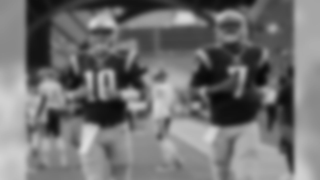 New England Patriots quarterbacks Jimmy Garoppolo (10) and Jacoby Brissett (7) take the field before a preseason NFL football game against the Chicago Bears Thursday, Aug. 18, 2016, in Foxborough, Mass. (AP Photo/Elise Amendola)