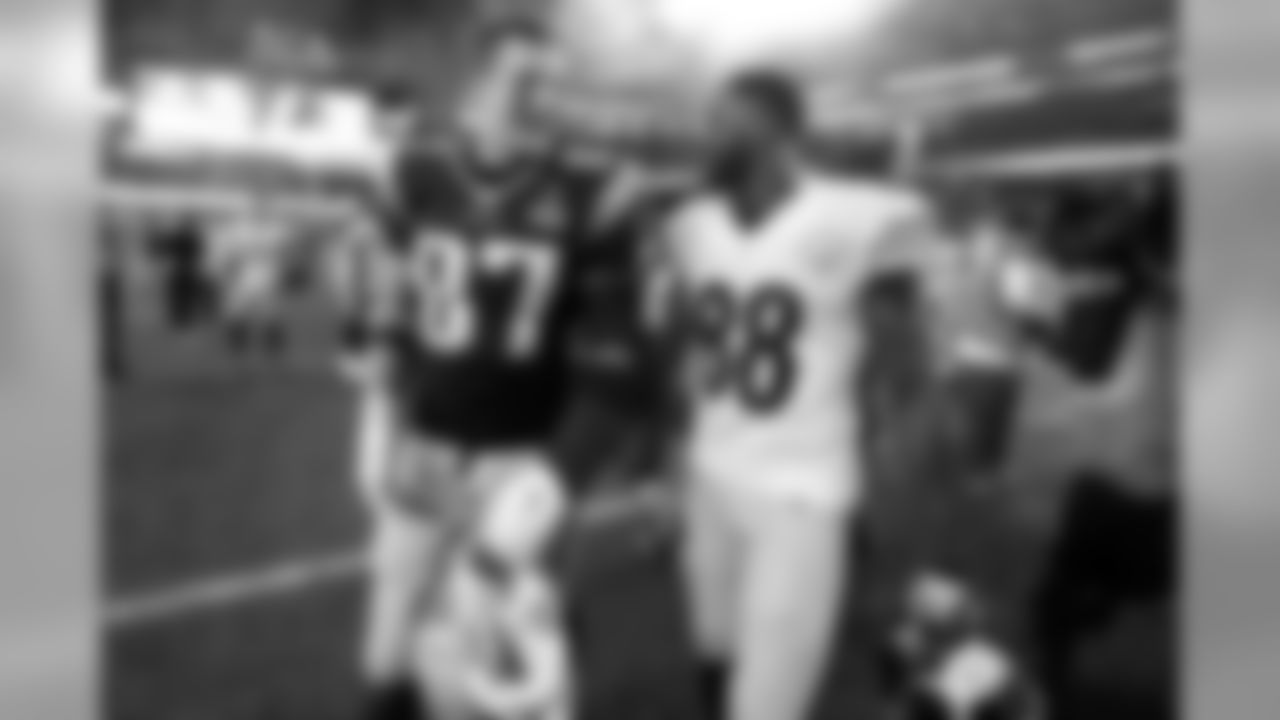 New England Patriots tight end Rob Gronkowski (87) and Pittsburgh Steelers wide receiver Darrius Heyward-Bey (88) walk off the field together post game at Gillette Stadium on Thursday, Sept. 10, 2015 in Foxborough, Mass. The Patriots won 28-21. (Ben Liebenberg via AP)