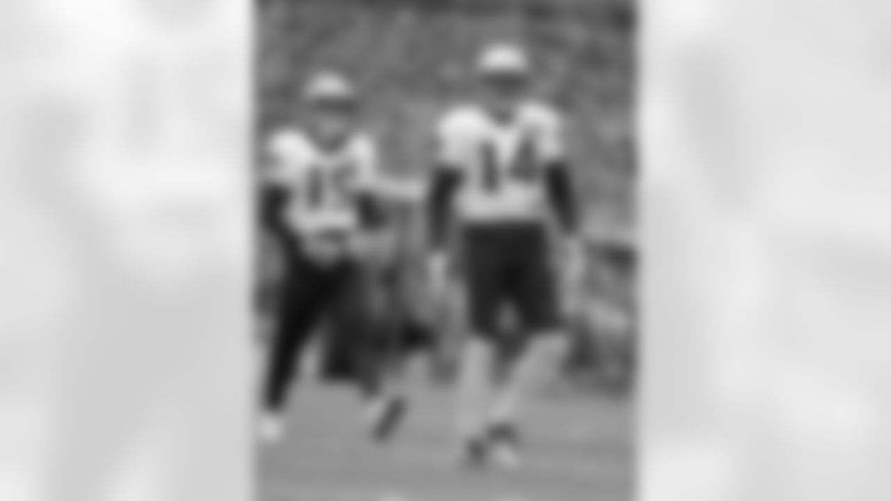 New England Patriots wide receivers Chris Hogan (15) and Michael Floyd (14) stretch while warming up during NFL football practice, Wednesday, Jan. 4, 2017, in Foxborough, Mass. (AP Photo/Steven Senne)