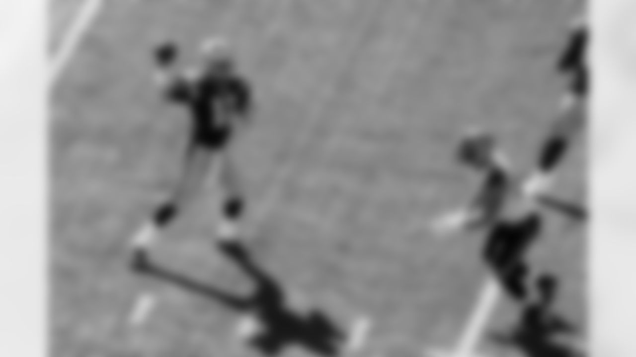 New England Patriots quarterback Tom Brady throws a touchdown pass, the 400th of his NFL career, in the first half of an NFL football game against the Jacksonville Jaguars, Sunday, Sept. 27, 2015, in Foxborough, Mass. (AP Photo/Stew Milne)