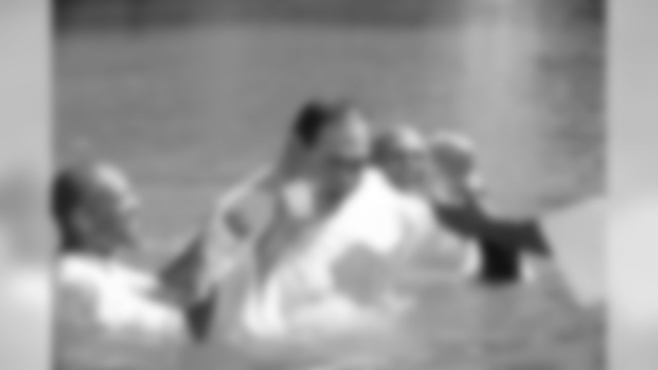 Hall of Fame President David Baker reacts after being baptized in the Jordan River.