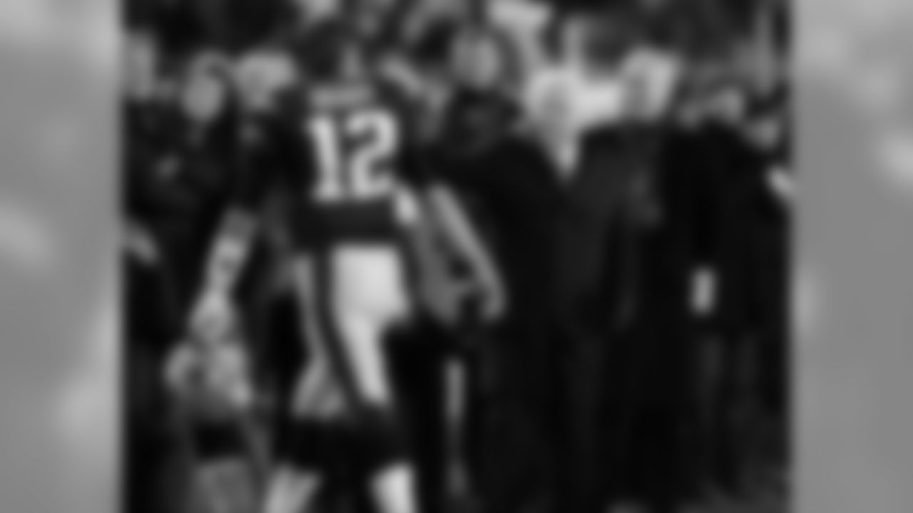 New England Patriots owner Robert Kraft pats New England Patriots quarterback Tom Brady (12) as he leaves the field after warmups before an NFL football game against the Buffalo Bills, Monday, Nov. 23, 2015, in Foxborough, Mass. (AP Photo/Charles Krupa)