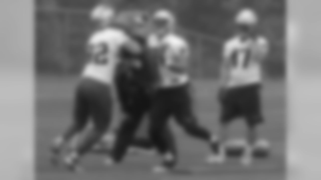 New England Patriots tights end Rob Gronkowski, center, and Matt Lengel, left, run through a drill as fullback Glenn Gronkowski (47) watches during an NFL football organized team activities practice Thursday, May 25, 2017, in Foxborough, Mass. (AP Photo/Bill Sikes)