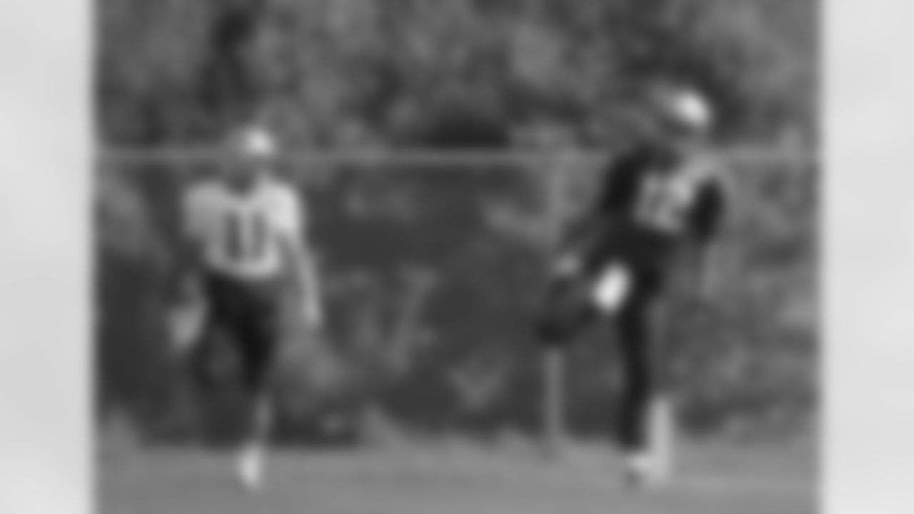 New England Patriots quarterback Tom Brady, right, and wide receiver Julian Edelman, left, stretch during an NFL football practice, Wednesday, Sept. 16, 2015, in Foxborough, Mass. (AP Photo/Steven Senne)