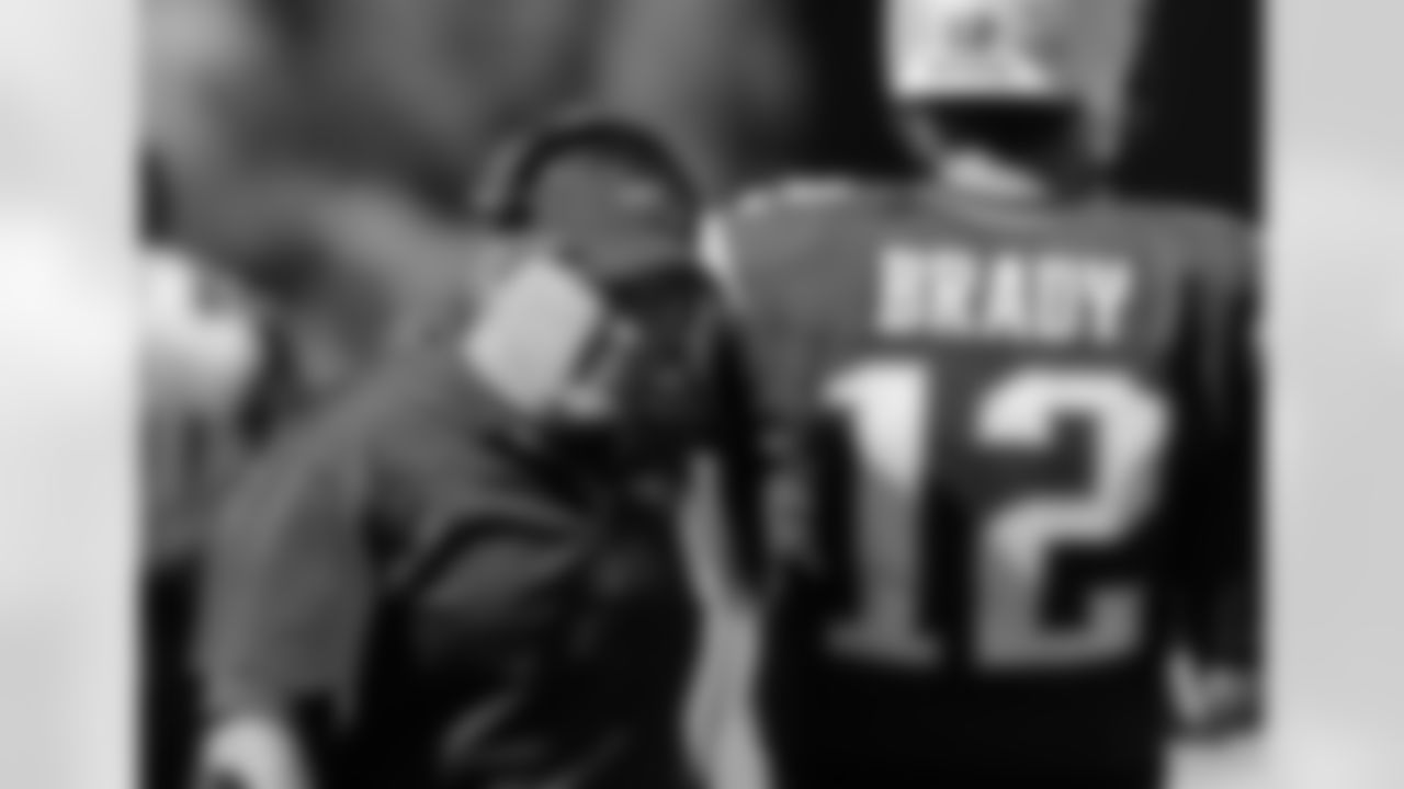 New England Patriots head coach Bill Belichick walks along the sideline beside quarterback Tom Brady in the first half of an NFL football game against the Jacksonville Jaguars, Sunday, Sept. 27, 2015, in Foxborough, Mass. (AP Photo/Charles Krupa)