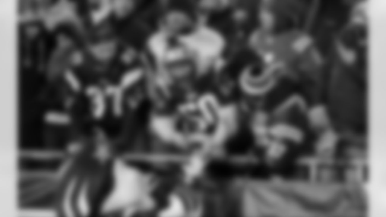 New England Patriots fans interact with mascot Pat Patriot in the second half of an NFL football game against the Buffalo Bills, Monday, Nov. 23, 2015, in Foxborough, Mass. (AP Photo/Steven Senne)