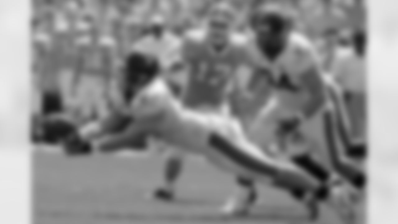 Virginia's Chris Long almost pulls down an interception against North Carolina during the first half of a college football game in Chapel Hill, N.C., Saturday, Sept. 15, 2007. (AP Photo/Gerry Broome)