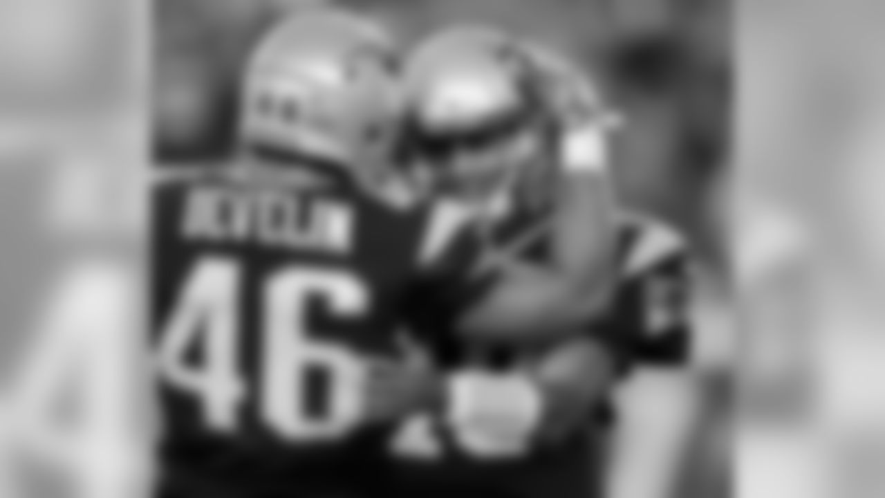 New England Patriots fullback James Develin (46) celebrates with quarterback Jimmy Garoppolo after the Patriots scored a 2-point conversion during the first half of an NFL preseason football game against the Green Bay Packers on Thursday, Aug. 13, 2015, in Foxborough, Mass. (AP Photo/Charles Krupa)
