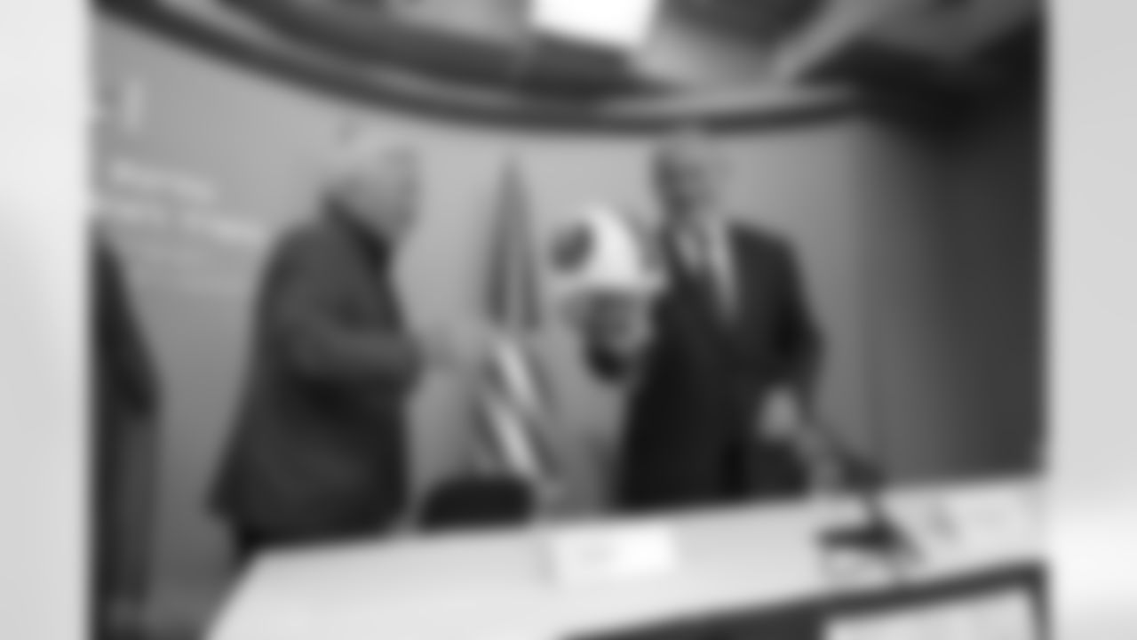 Robert Kraft presents a helmet signed by the Hall of Famers to Israel Prime Minister Benjamin Netanyahu during a VIP briefing.