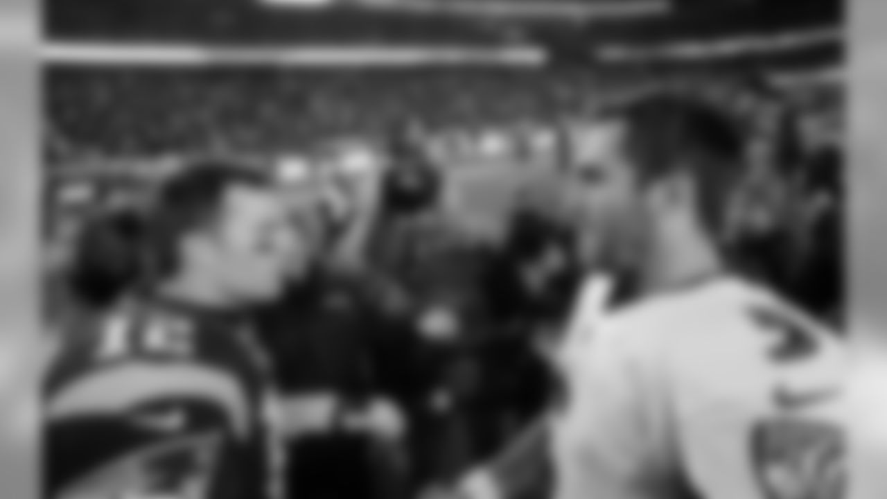 New England Patriots quarterback Tom Brady (12) and Baltimore Ravens quarterback Joe Flacco (5) speak at midfield after an NFL football game, Monday, Dec. 12, 2016, in Foxborough, Mass. (AP Photo/Steven Senne)
