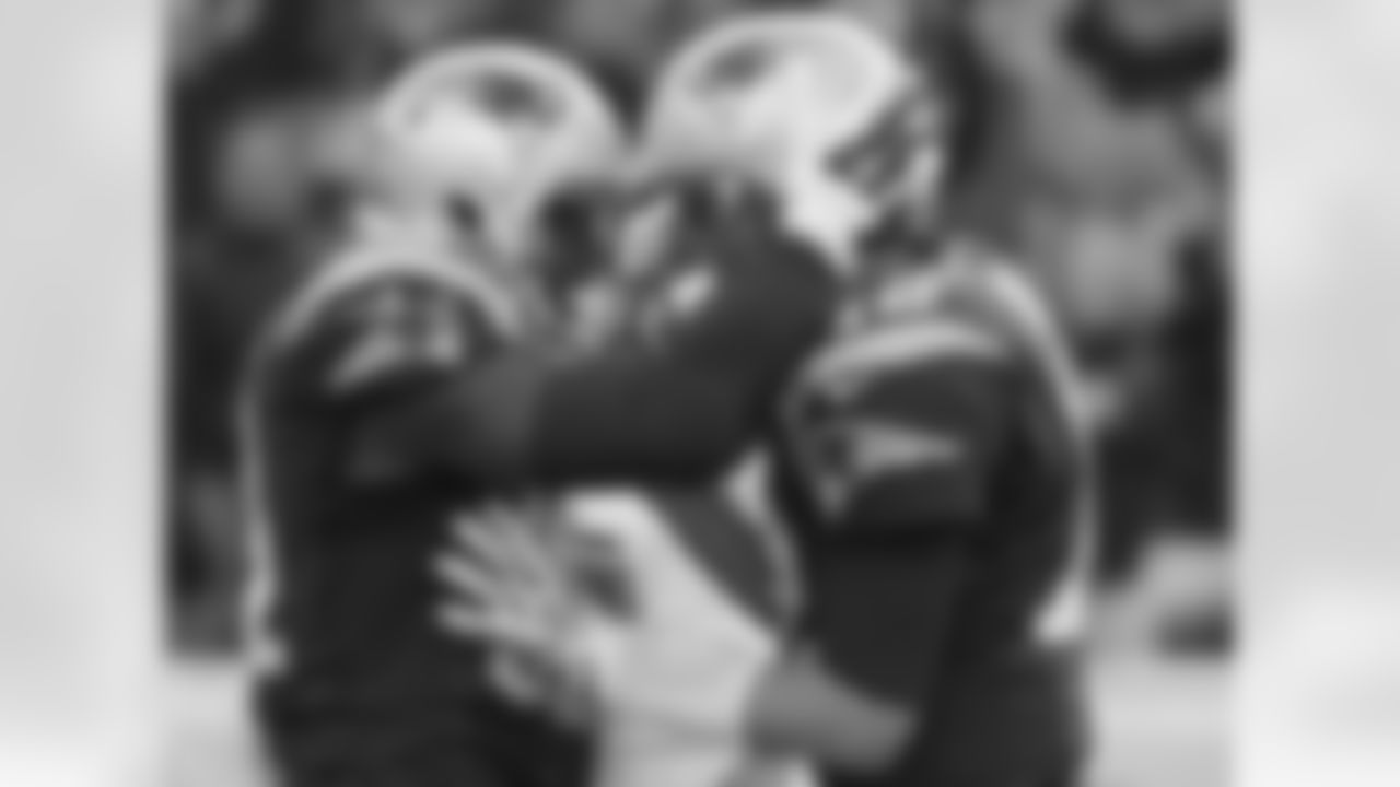 New England Patriots tight end Timothy Wright, left, celebrates after catching his second touchdown pass from Tom Brady, right, in the first half of an NFL football game against the Detroit Lions, Sunday, Nov. 23, 2014, in Foxborough, Mass. (AP Photo/Steven Senne)