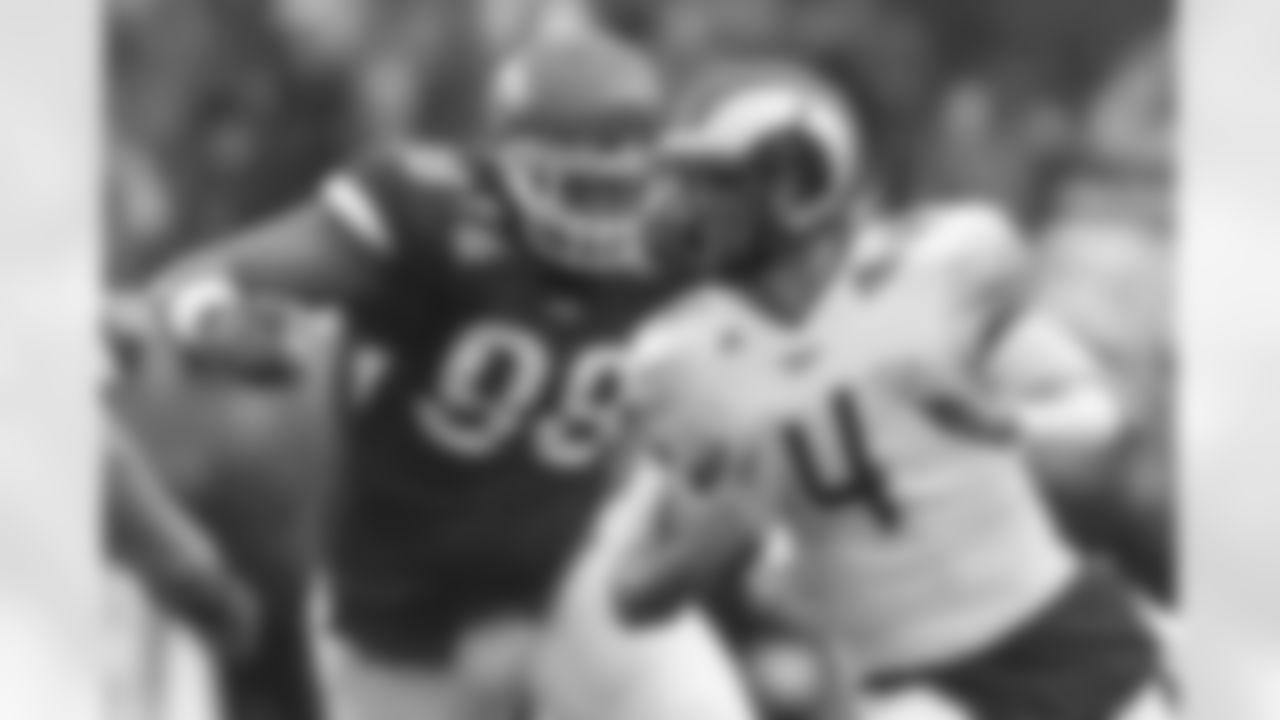 Colorado State quarterback Pete Thomas (4) is chased by Utah defensive tackle Sealver Siliga (98) during the first half of an NCAA college football game Saturday, Oct. 23, 2010, in Salt Lake City.  (AP Photo/Jim Urquhart)