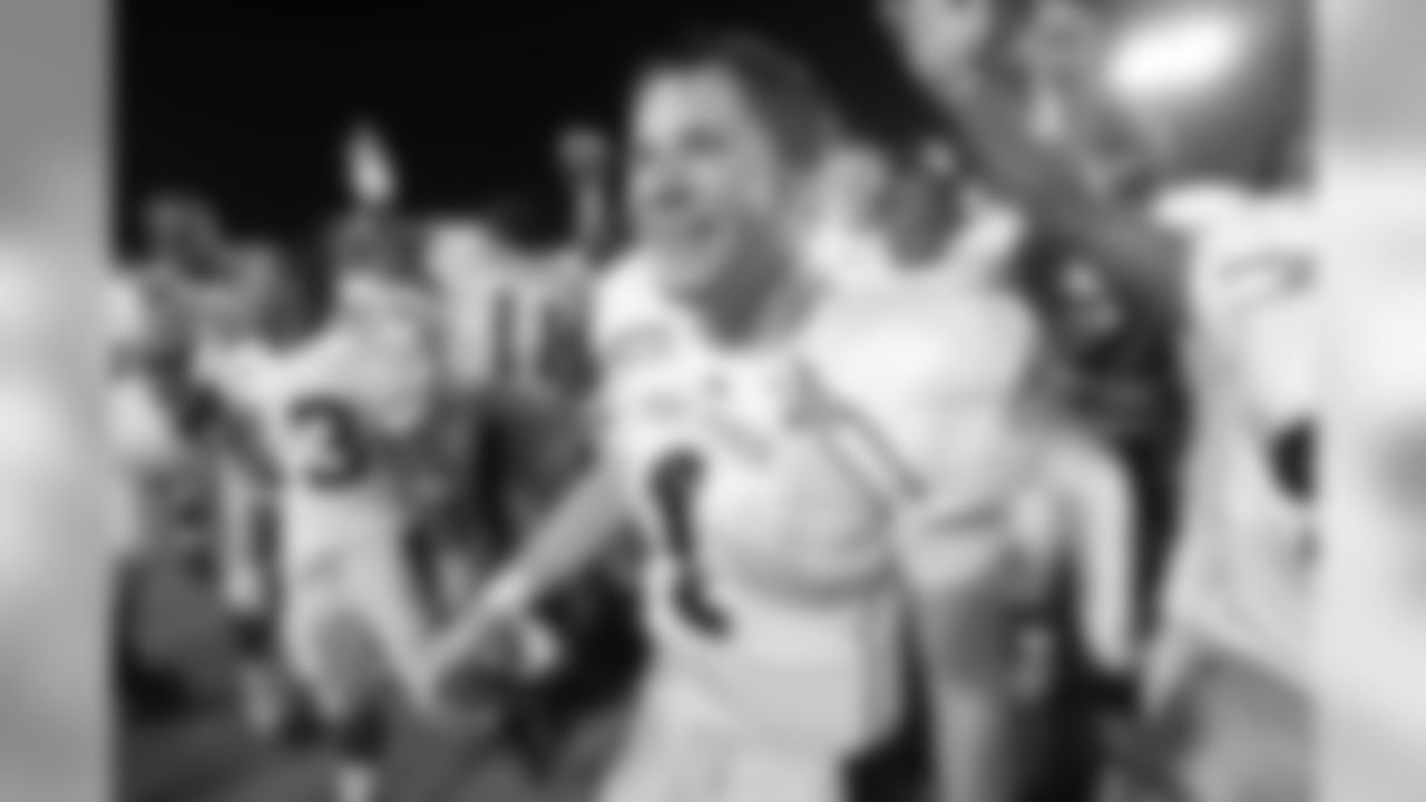 Kent State quarterback Julian Edelman celebrates with teammates after their 23-14 victory over Iowa State in a football game Thursday, Aug. 30, 2007, in Ames, Iowa. (AP Photo/Charlie Neibergall)