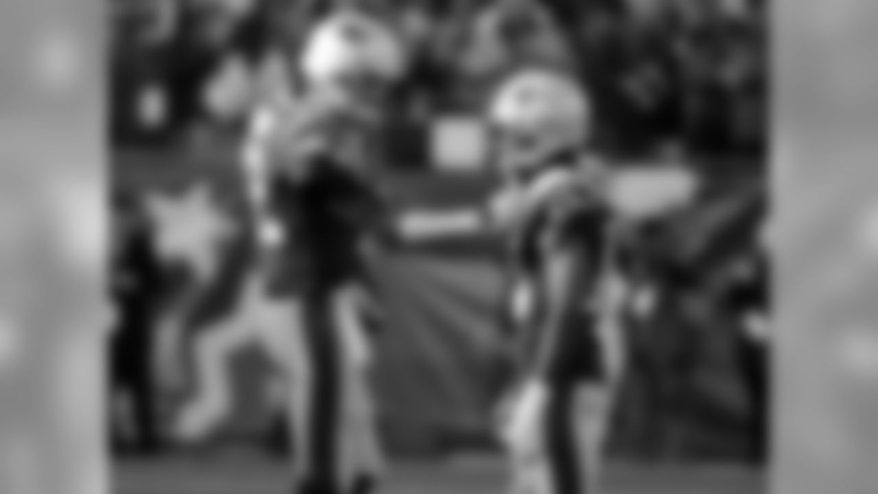 New England Patriots quarterback Tom Brady, left, talks to wide receiver Brandin Cooks as they warm up before the AFC championship NFL football game against the Jacksonville Jaguars, Sunday, Jan. 21, 2018, in Foxborough, Mass. (AP Photo/David J. Phillip)