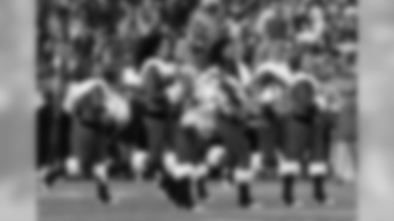 The New England Patriots cheerleaders perform wearing Christmas outfits before an NFL football game between the Patriots and the Buffalo Bills, Sunday, Dec. 24, 2017, in Foxborough, Mass. (AP Photo/Charles Krupa)