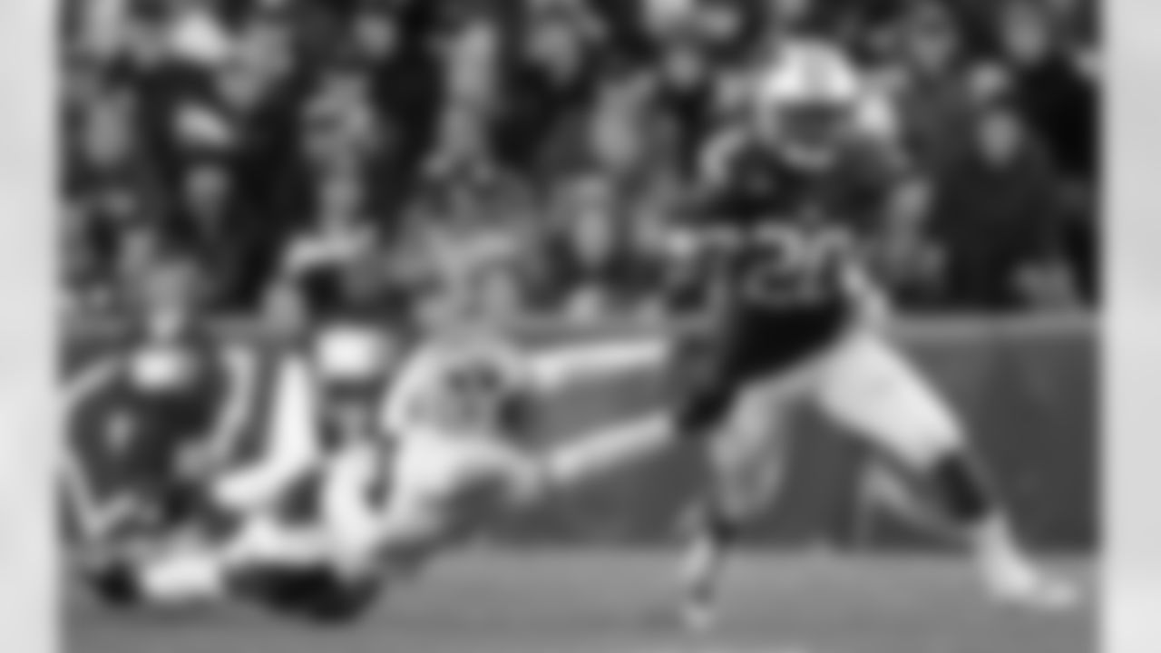 Wisconsin's James White, right, gets past Brigham Young's Robertson Daniel during the second half of an NCAA college football game on Saturday, Nov. 9, 2013, in Madison, Wis. Wisconsin won 27-17. (AP Photo/Morry Gash)