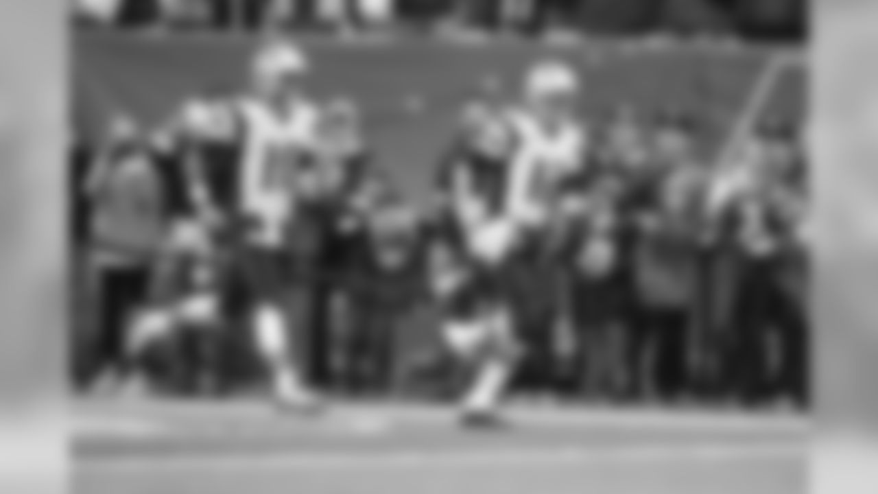 New England Patriots quarterback Tom Brady (12) and Jimmy Garoppolo (10) run on the field before an NFL football game against the New York Jets Sunday, Dec. 27, 2015, in East Rutherford, N.J. (AP Photo/Kathy Willens)