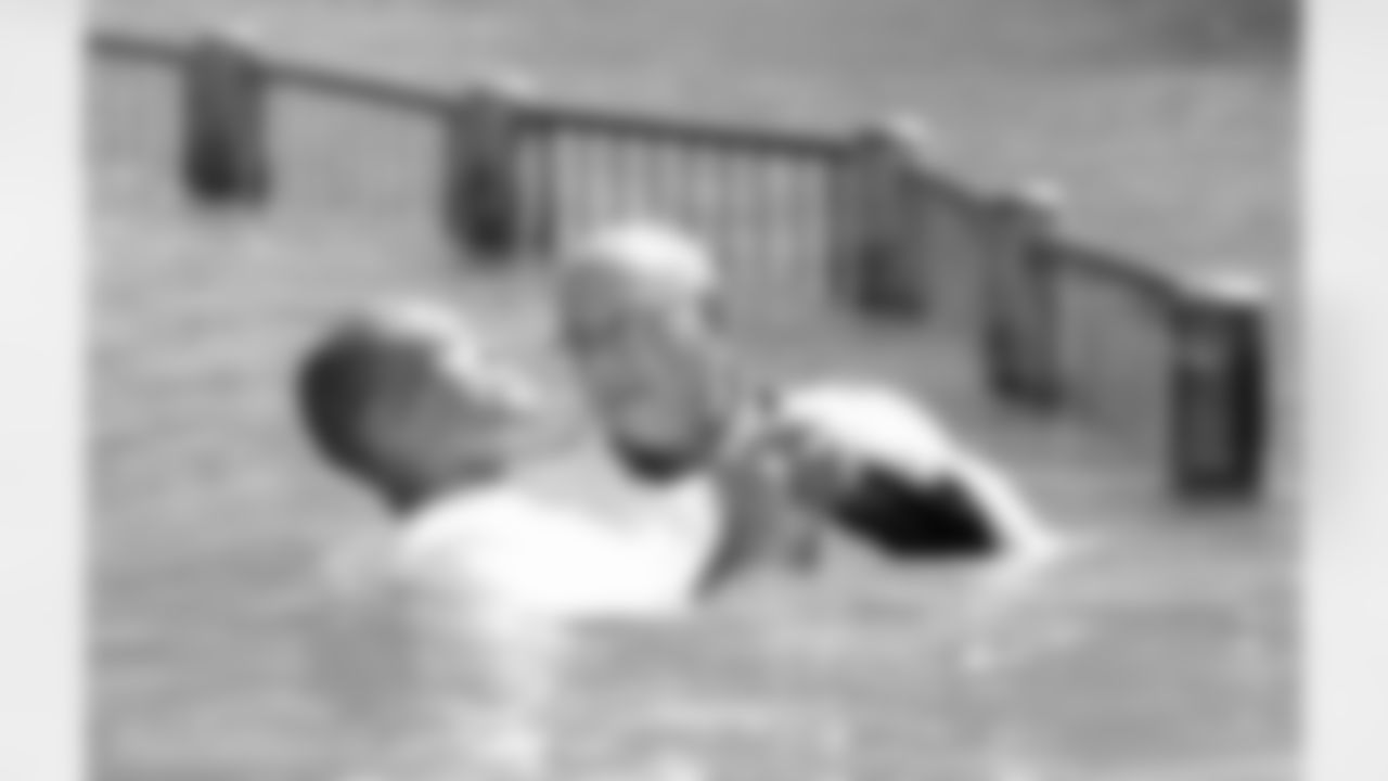 Aeneas Williams is baptized in the Jordan River.
