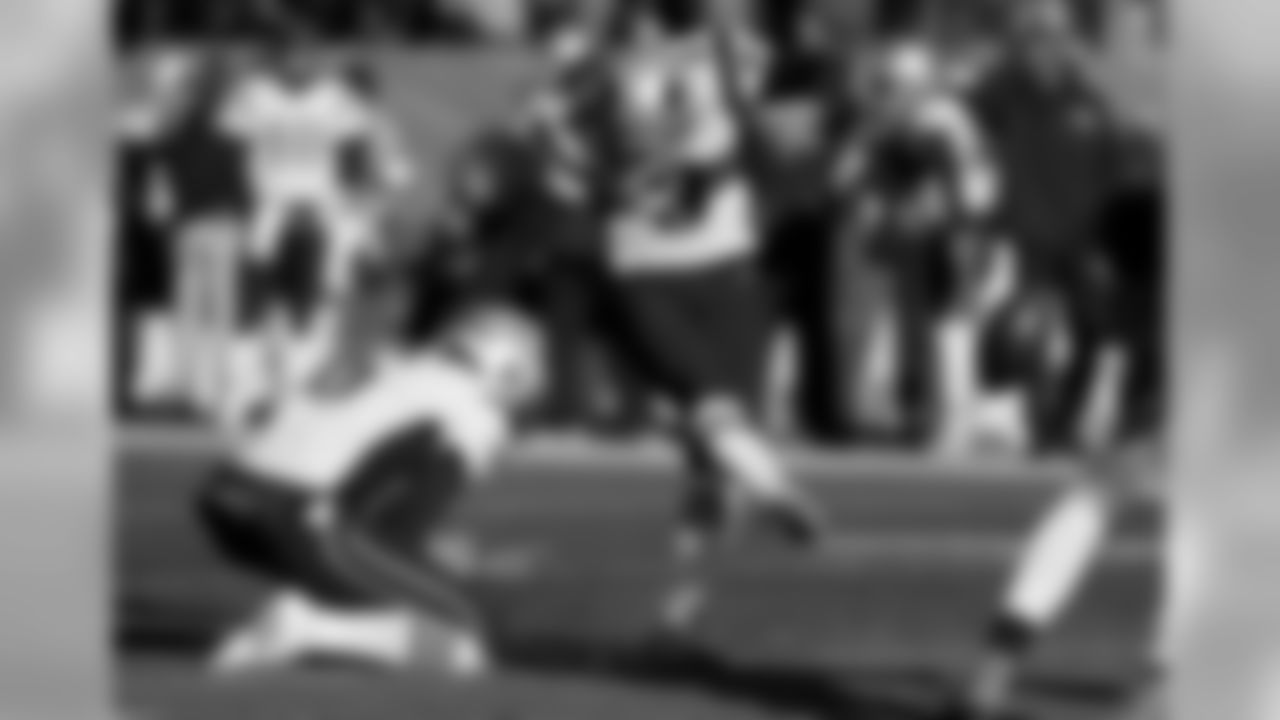 New England Patriots kicker Stephen Gostkowski kicks a field goal as punter Ryan Allen holds during the first half of an NFL football game against the Denver Broncos Sunday, Dec. 18, 2016, in Denver. (AP Photo/Jack Dempsey)