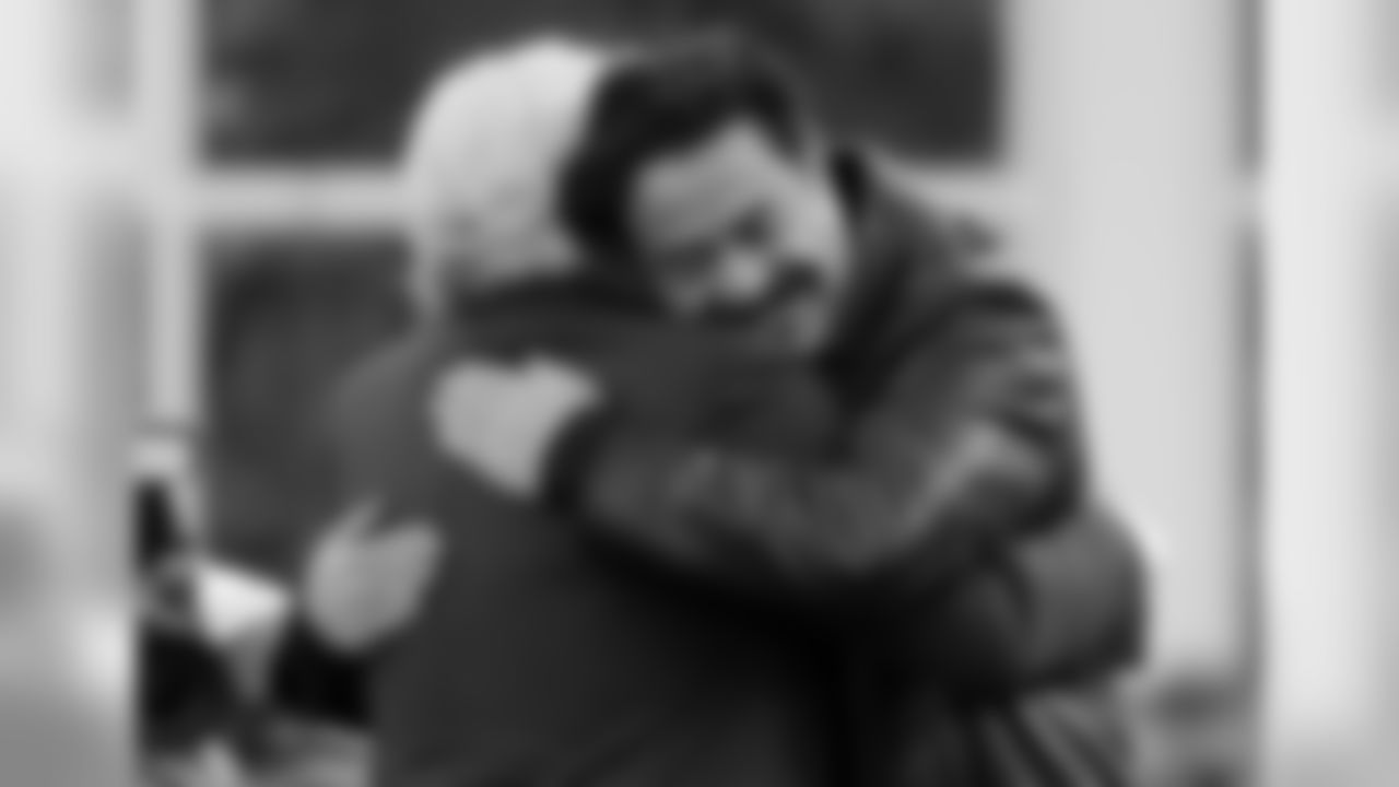New England Patriots owner Robert Kraft, left, embraces Jacksonville Jaguars owner Shahid Khan before the AFC championship NFL football game, Sunday, Jan. 21, 2018, in Foxborough, Mass. (AP Photo/Steven Senne)