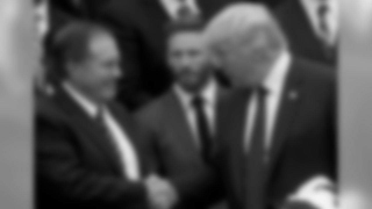 President Donald Trump shakes hands with New England Patriots head coach Bill Belichick during a ceremony on the South Lawn of the White House in Washington, Wednesday, April 19, 2017, where the president honored the Super Bowl Champion New England Patriots for their Super Bowl LI victory. Also pictured is New England Patriots wide receiver Julian Edelman, center. (AP Photo/Andrew Harnik)