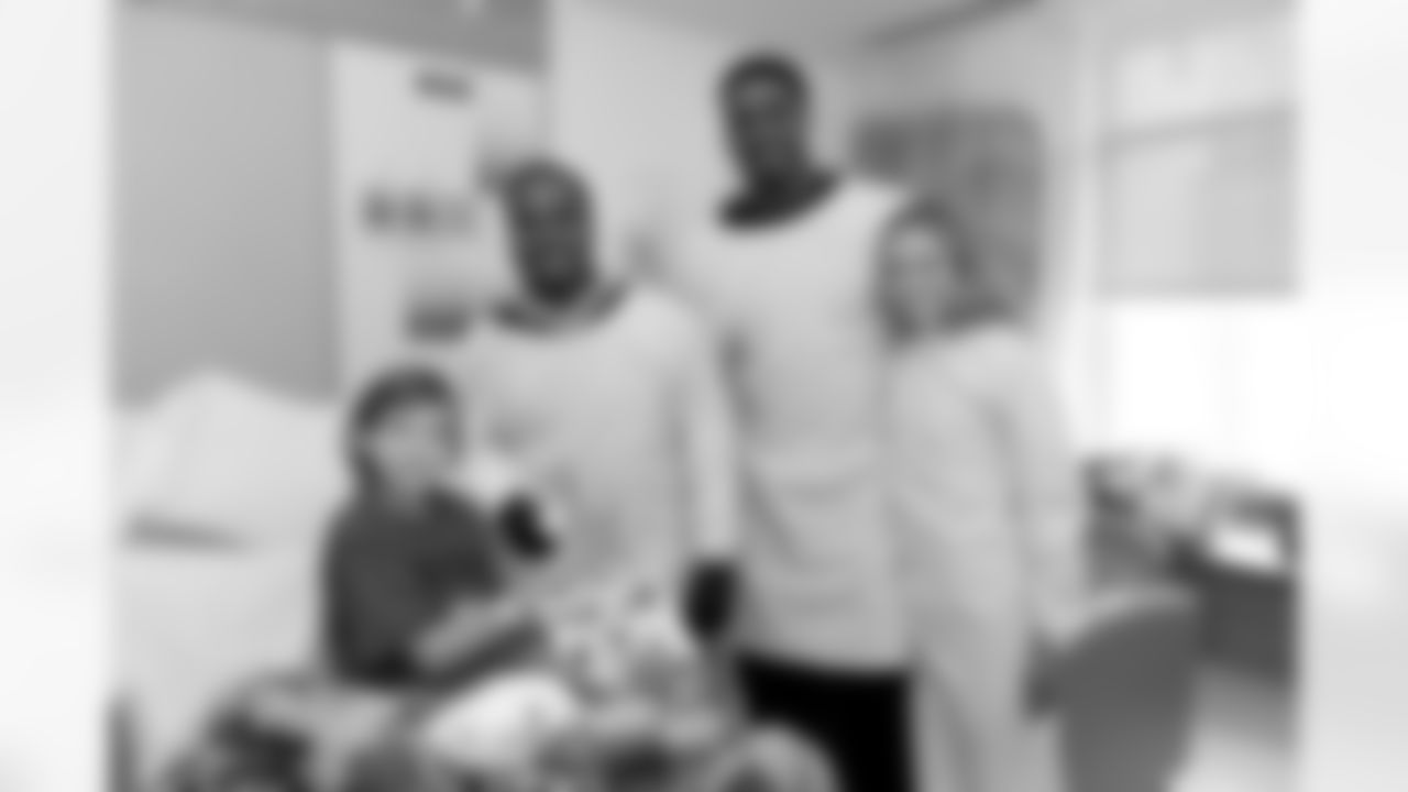 BOSTON, MA - FEBRUARY 10: New England Patriot's Dion Lewis (L), Geneo Grissom, and wife Haley visit Camryn at Boston Children's Hospital February 10, 2016 in Boston, Massachusetts. (Photo by Darren McCollester/Getty Images for Boston Children's Hospital)