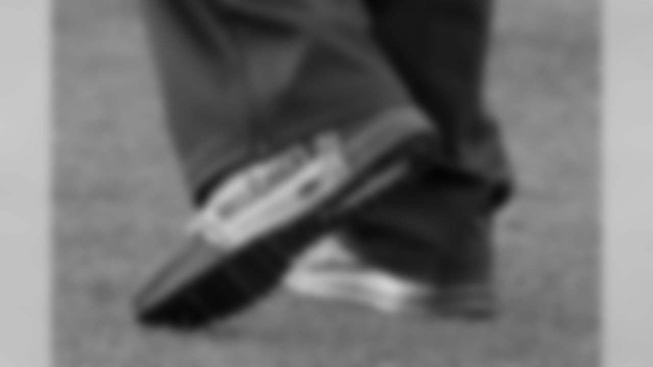 The shoes of New England Patriots head coach Bill Belichick are seen during the second half of an NFL football game against the Buffalo Bills, Sunday, Dec. 3, 2017, in Orchard Park, N.Y. (AP Photo/Adrian Kraus)