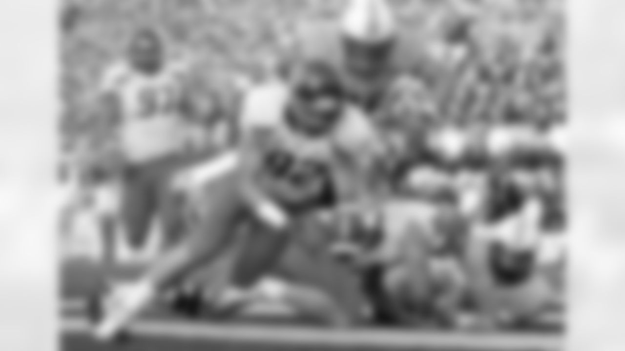 Boise State defensive lineman Shea McClellin recovers a fumble by Wyoming quarterback Austyn Carta-Samuels, right, for a touchdown during the first quarter of an NCAA college football game Saturday, Sept. 18, 2010, in Laramie, Wyo. ( AP Photo/AAron Ontiveroz)