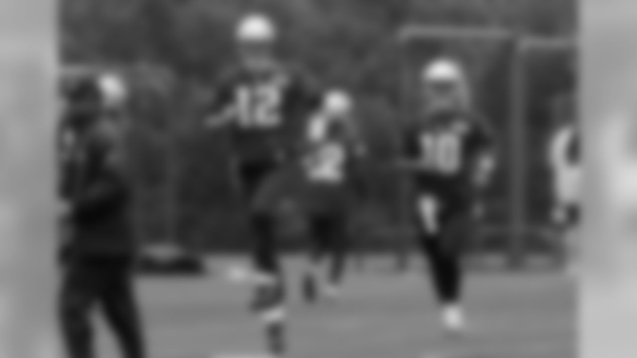 New England Patriots quarterbacks Tom Brady (12) and Jimmy Garoppolo (10) run through a drill during an NFL football organized team activities practice Thursday, May 25, 2017, in Foxborough, Mass. (AP Photo/Bill Sikes)