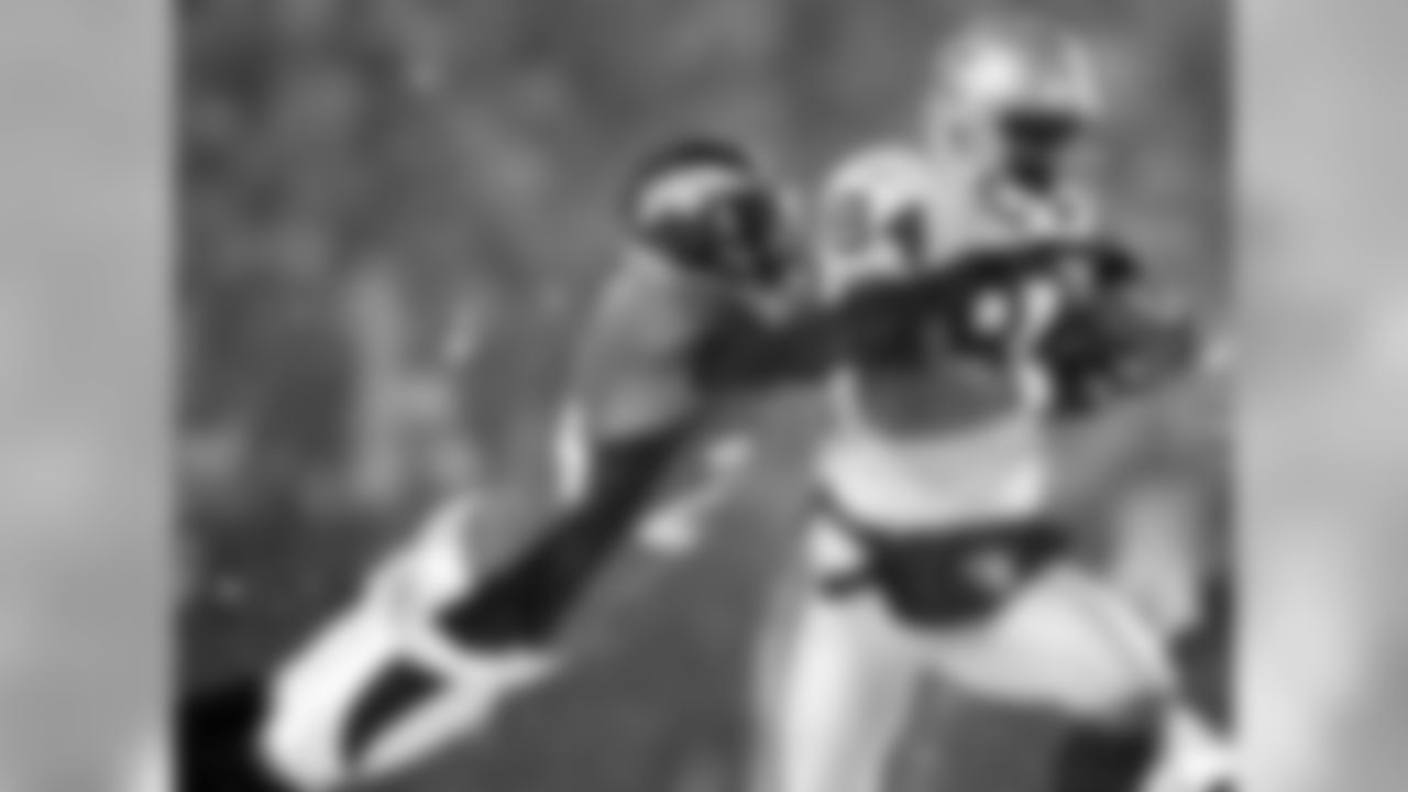 2004 - Raiders 25, Broncos 24 - SNF
Wide receiver Ronald Curry made an improbable spinning one-handed touchdown catch in the snow, and offensive lineman Langston Walker blocked a potential game-winning field goal attempt as the Raiders hung on to defeat the Broncos 25-24 in Denver on Sunday Night Football in 2004. (AP Photo)