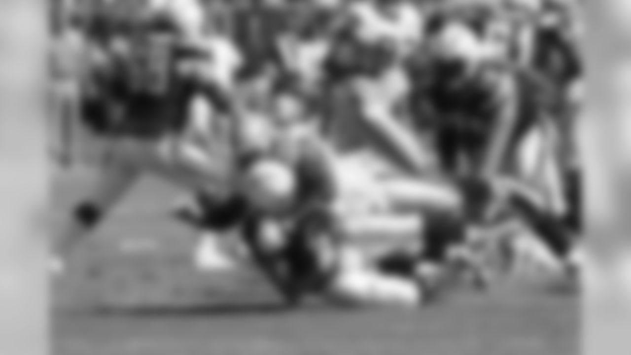 Terdell Sands brings down the Chargers quarterback during the 2008 regular season.
