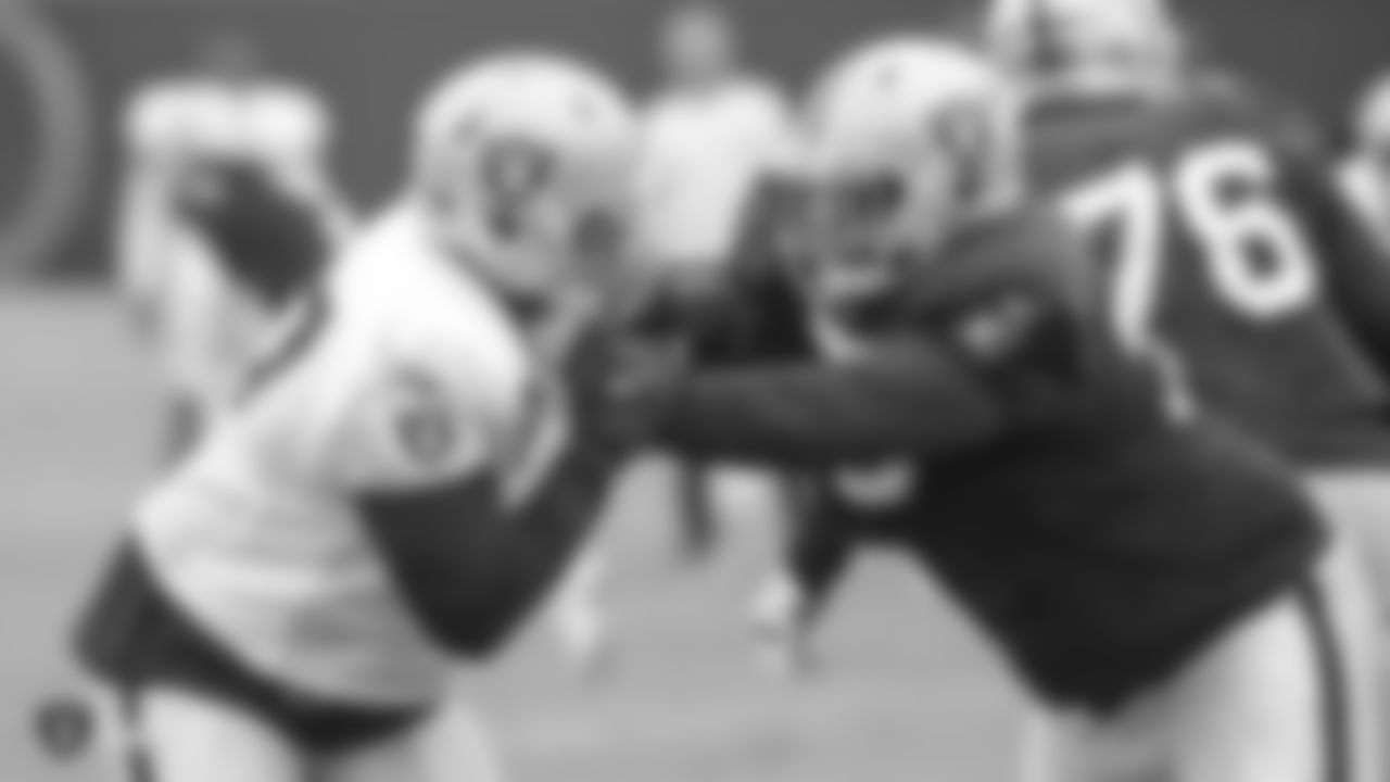 Oakland Raiders defensive end Mario Edwards Jr. (97) and offensive guard Denver Kirland (79) on the field for a preseason practice at the Oakland Raiders Practice Facility, Tuesday, August 21, 2018, in Alameda, California.