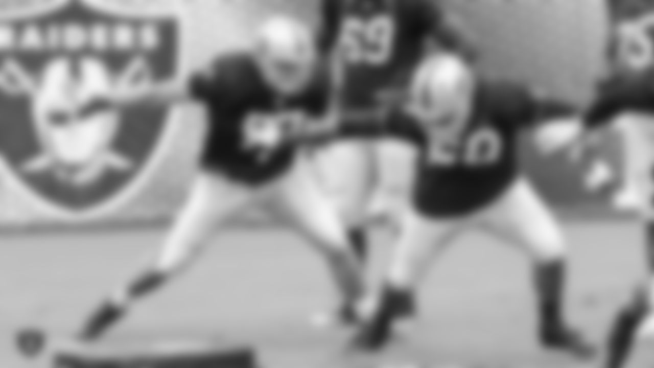 Oakland Raiders offensive tackle Kolton Miller (77) and offensive lineman Oday Aboushi (60) on the field for a preseason practice at the Oakland Raiders Practice Facility, Tuesday, August 21, 2018, in Alameda, California.
