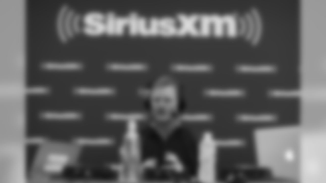 General manager of the Los Angeles Rams Les Snead talks on a SiriusXM radio show prior to the NFL football scouting combine on Thursday, March 1, 2018 in Indianapolis. (Aaron M. Sprecher via AP)