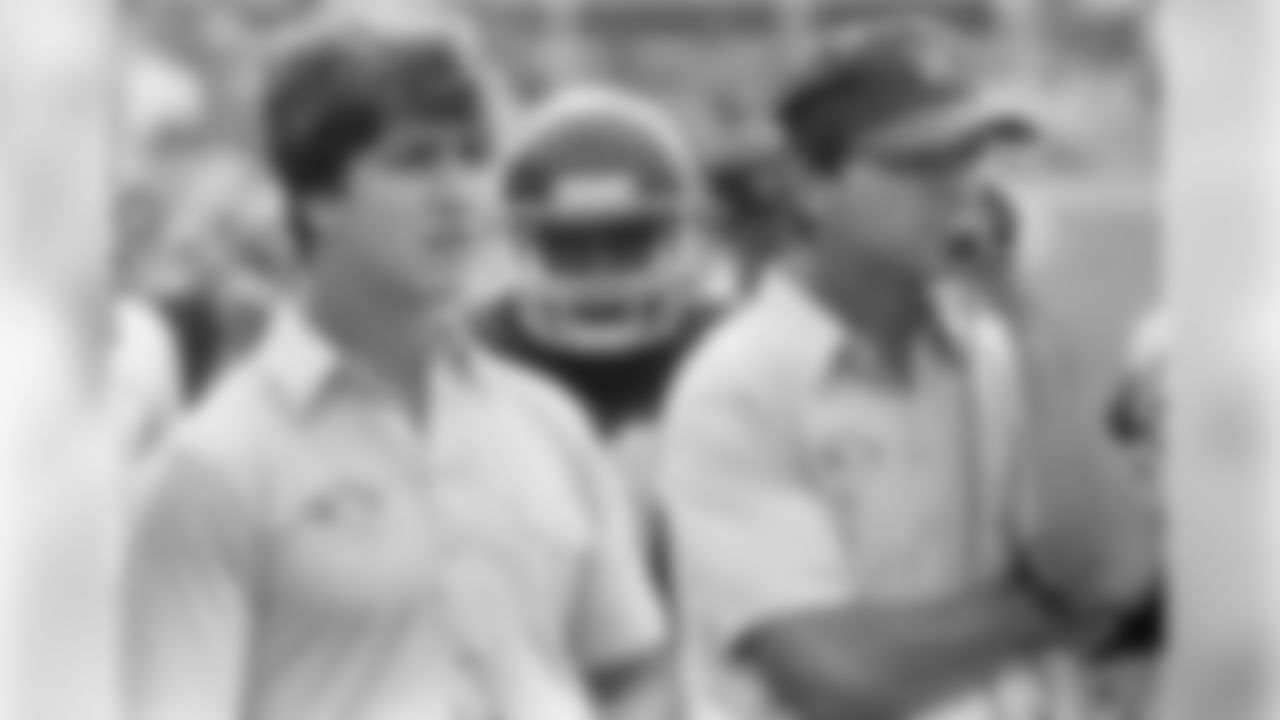 John on the Western Michigan University's sidelines with his father Jack Harbaugh.