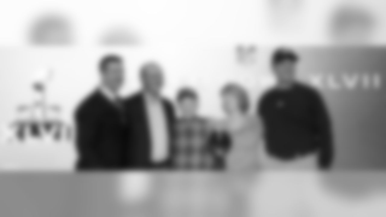 John, Jack, Jackie, and Jim Harbaugh are joined by their grandfather Joe Cipiti for a family photo at the Super Bowl XLVII Press Conference.