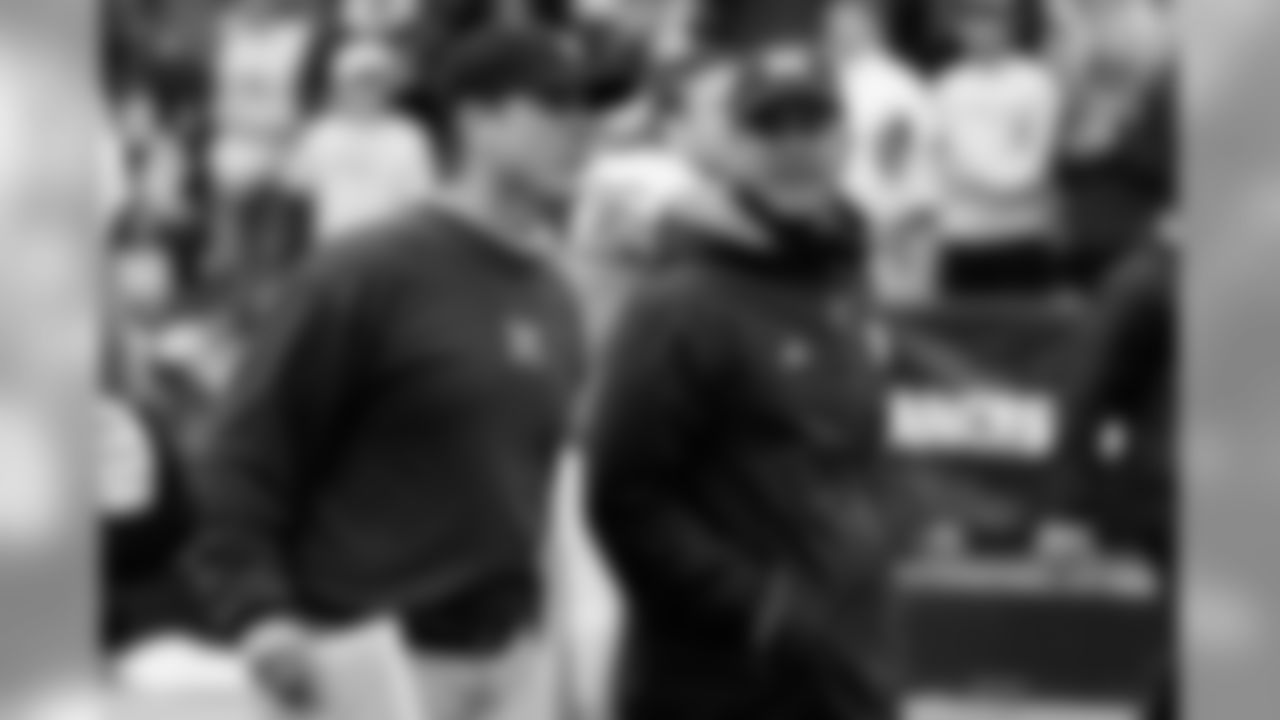 John Harbaugh visiting his brother Jim at the University of Michigan.