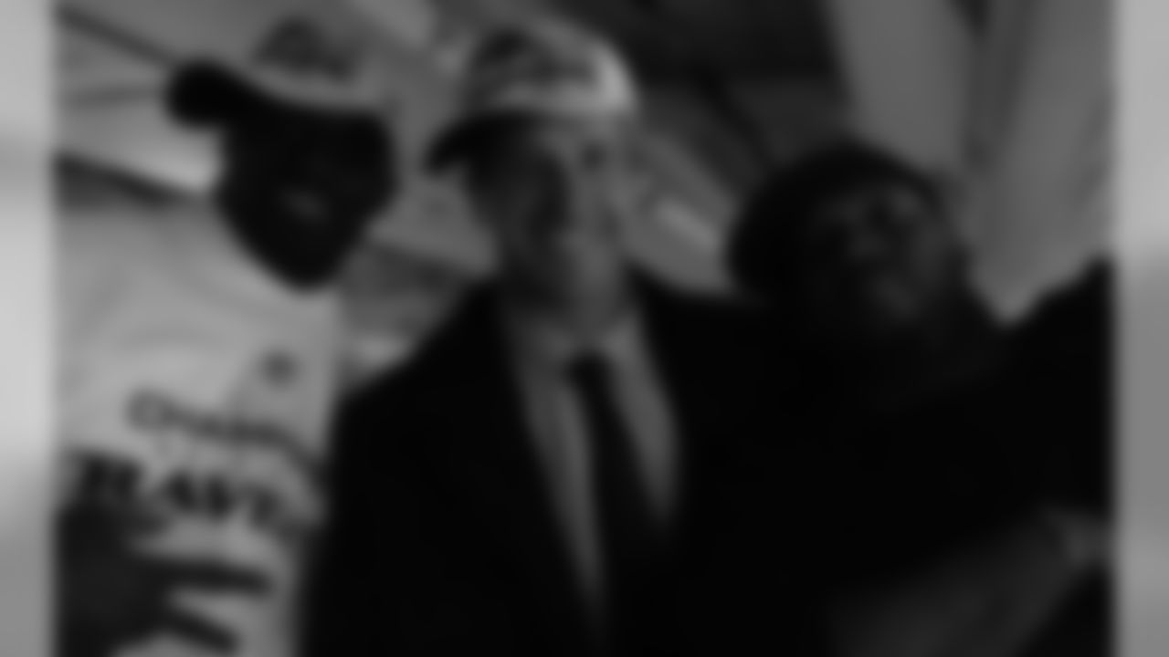 John Harbaugh with Terrell Suggs and James Ihedigbo.