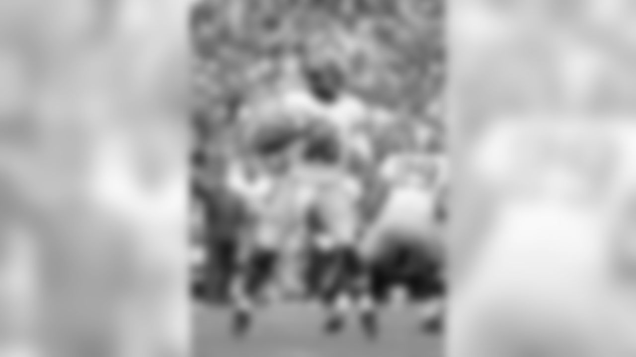 No. 12- Redskins quarterback Robert Griffin III stands tall in the pocket and passed for 320 yards vs. the Packers on Sunday, Sept. 15, 2013. This marked the first time in his career where Griffin has thrown back to back 300 plus yard games.