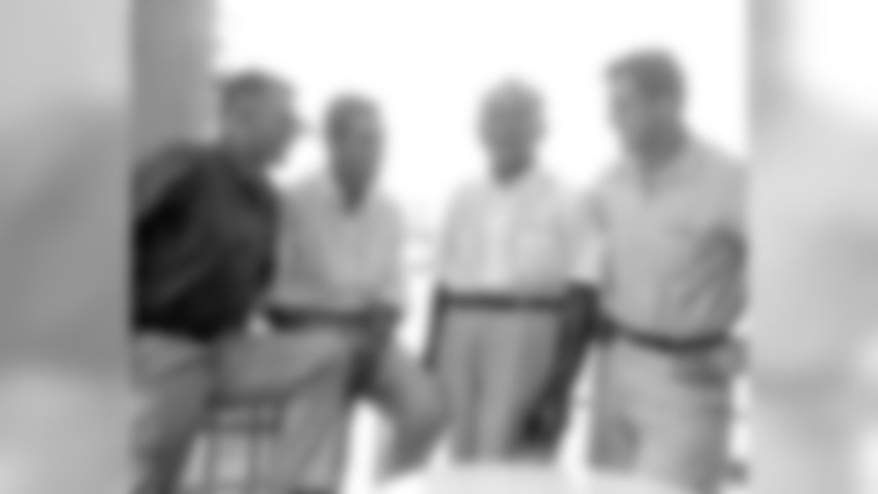 Eddie LeBaron (far left) with teammates. LeBaron was drafted in the 10th round (123rd overall) in the 1950 NFL Draft by the Washington Redskins.