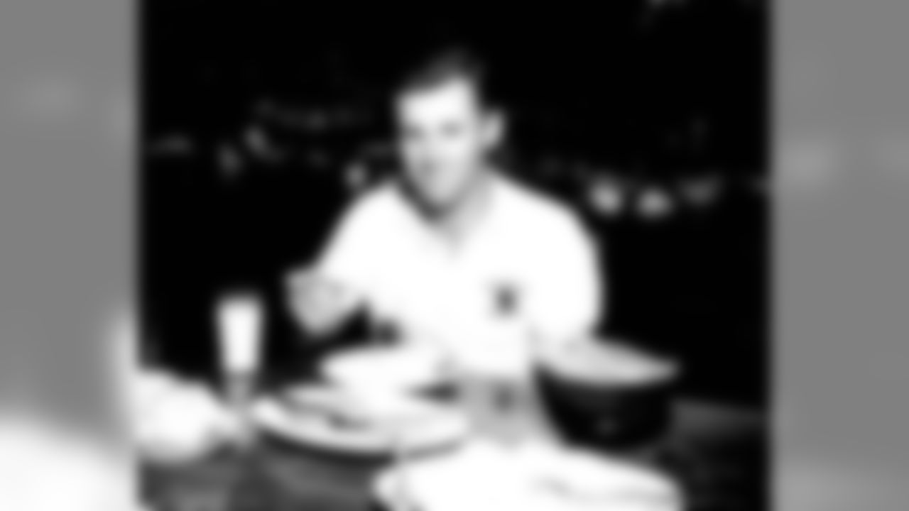 Eddie LeBaron having a bite to eat. Over his 11 seasons in the NFL, the quarterback made four Pro Bowls and even converted on six extra point attempts for the Redskins as a rookie.