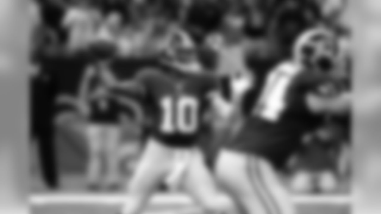 No. 10:Griffin III throwing to an open Redskins reciever.
