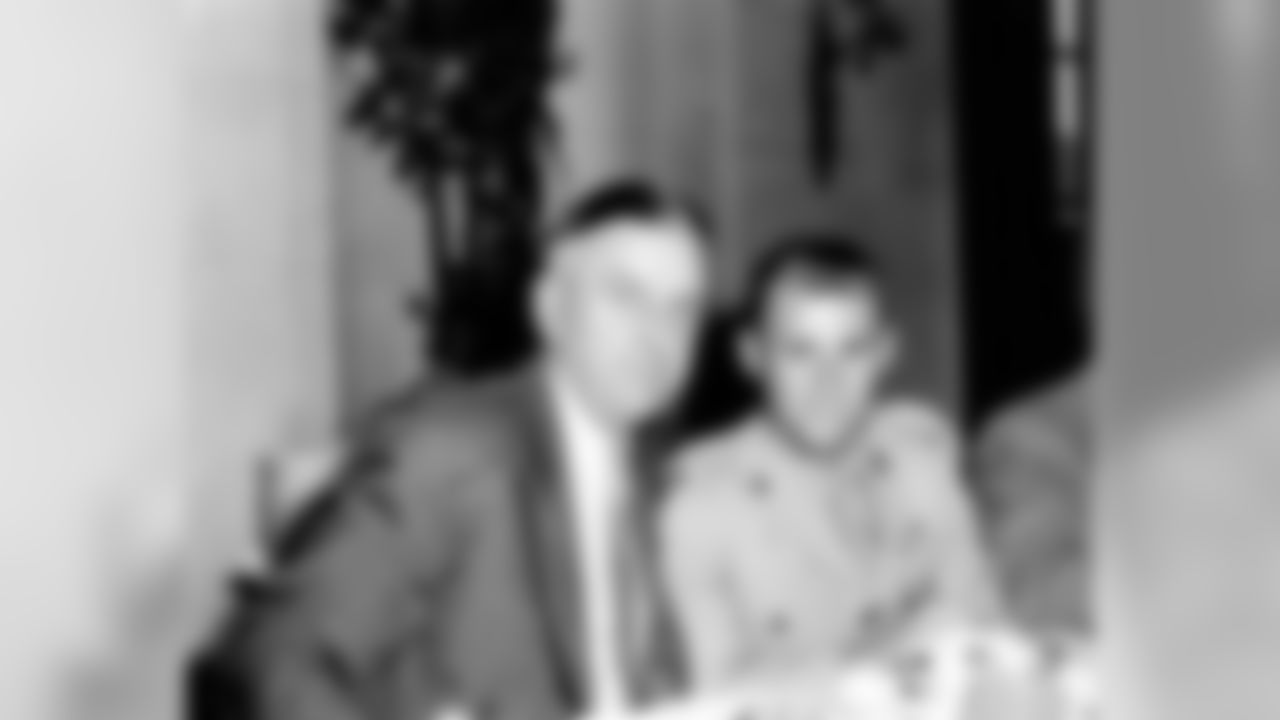 Eddie LeBaron (right) with George Preston Marshall (left).