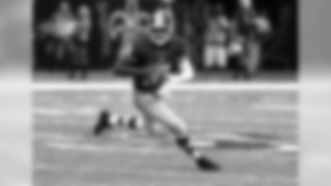 No. 9: Griffin III rolling out to avoid Saints defense.