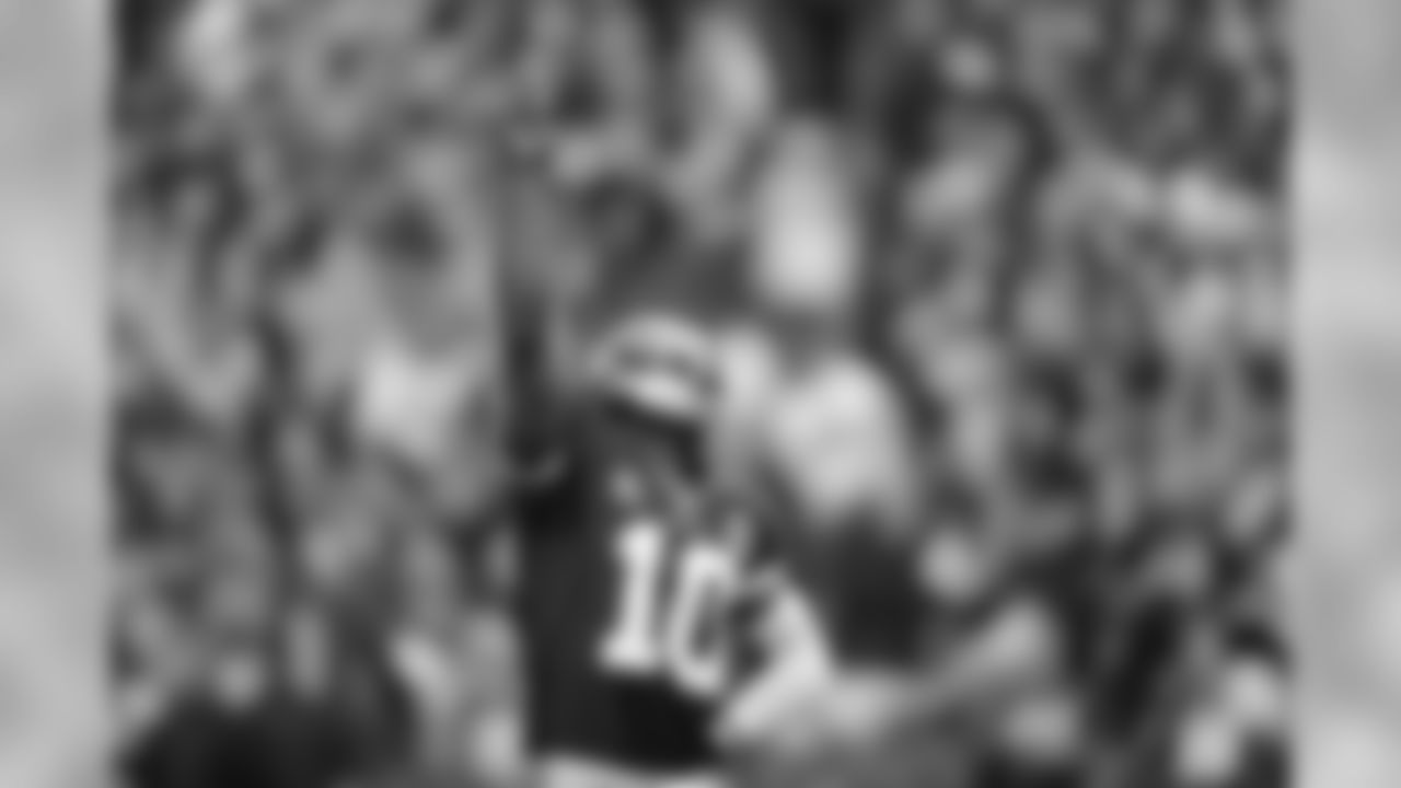 Redskins QB Robert Griffin III celebrates after throwing a touchdown pass.