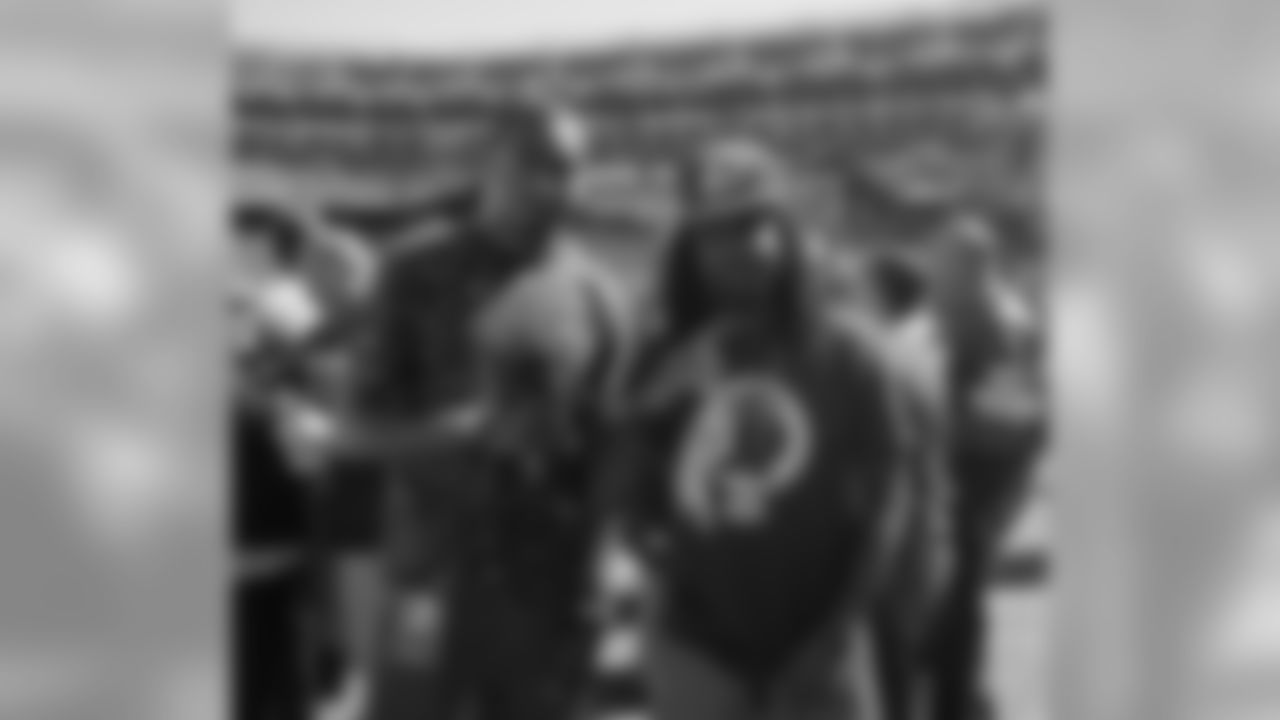 Washington Wizards PG John Wall and rapper Wale meet with fans before the game